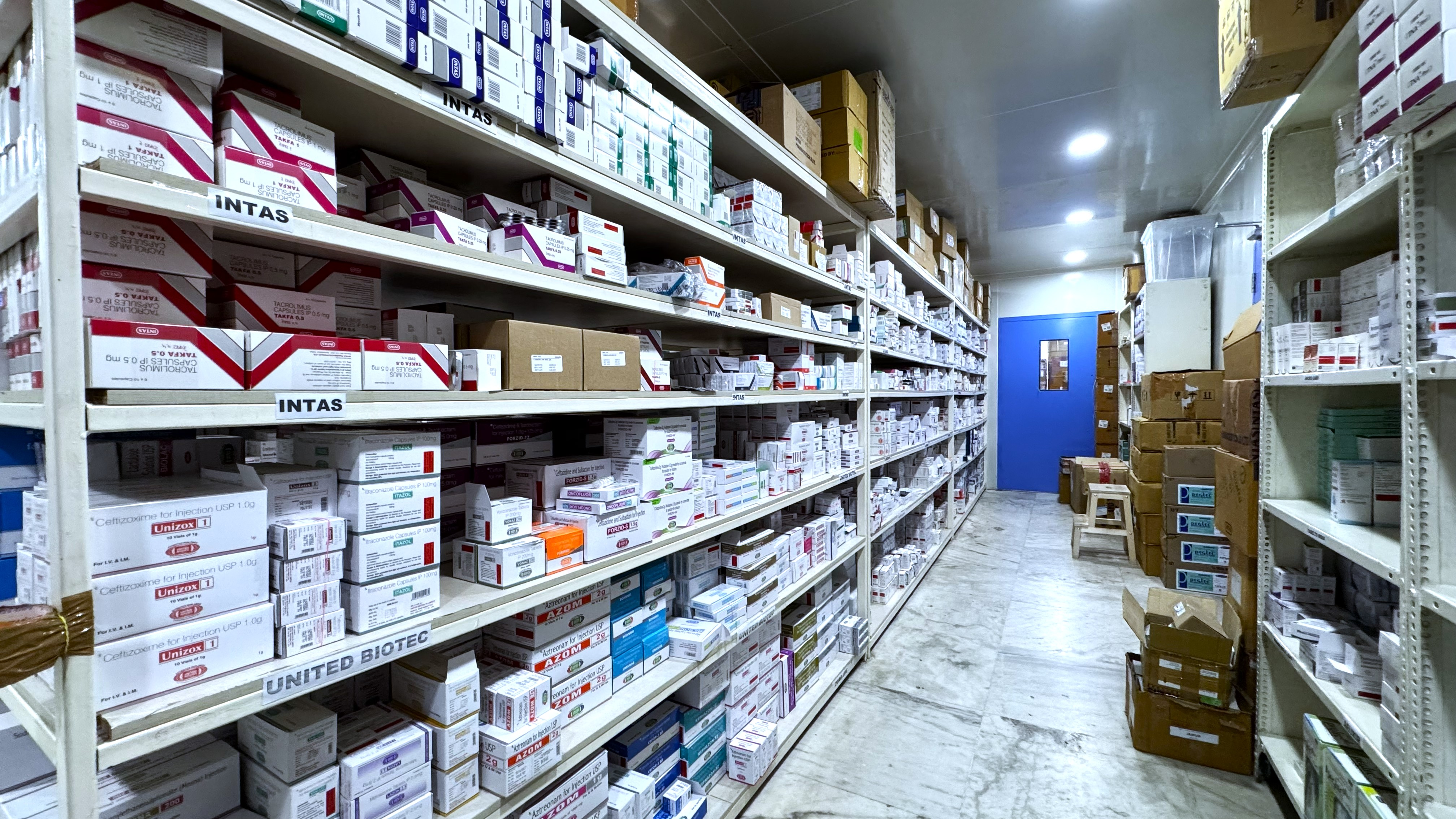 Healthcare professional carefully organizing medical supply boxes